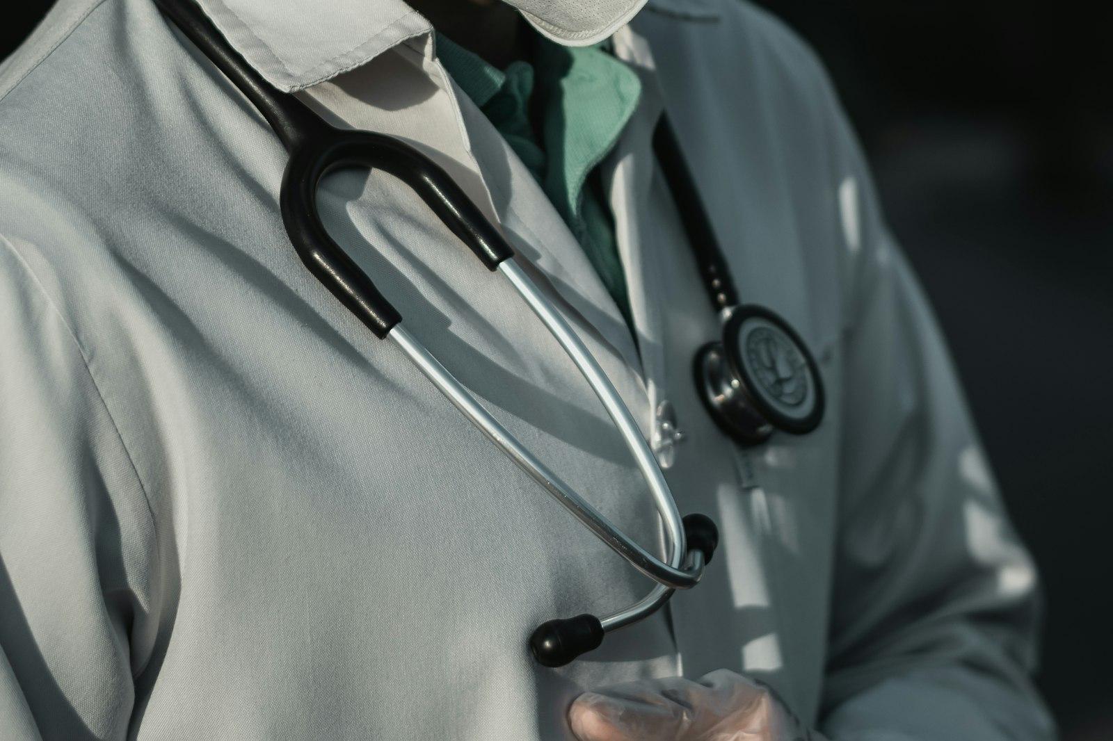 Stethoscope resting on a white clinical coat